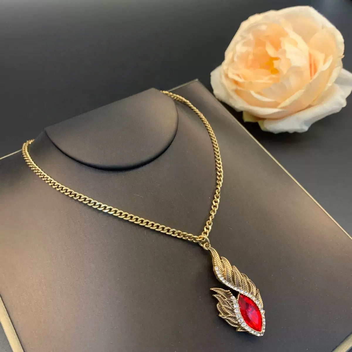 Luxe Red Gem Feather Necklace - Textured Gold Frame